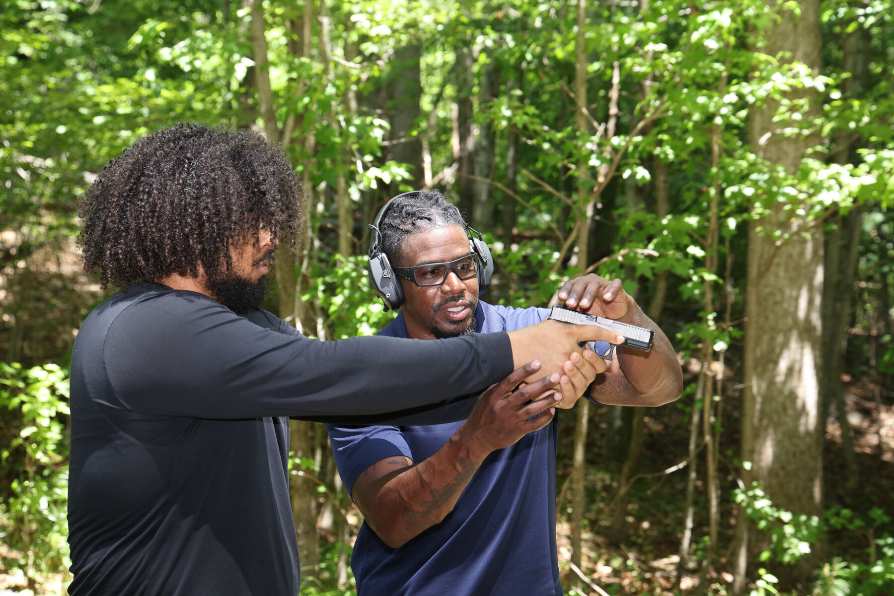 Hands-on coaching of shooting stance and grip